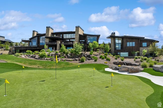 View of home's community featuring an area to practice putting and view of golf course | Image 70