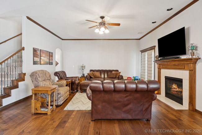 Hardwood floors, crown molding and fireplace! | Image 11