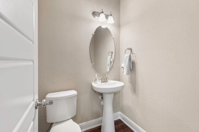 Bathroom with toilet and wood finished floors | Image 24