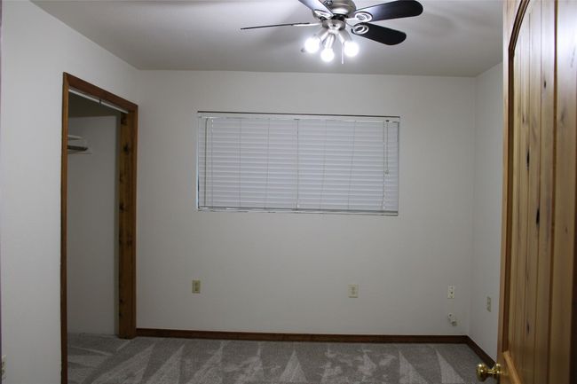Third bedroom with carpet floors & natural baseboards | Image 20