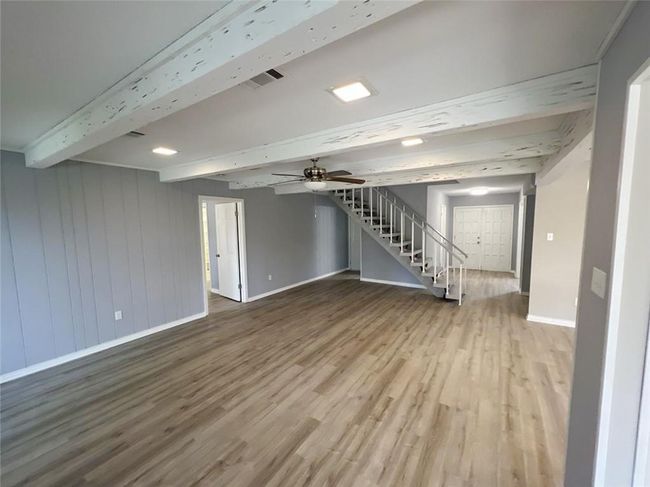 Great Room looking toward foyer, Master and hallway to Garage entrance | Image 8