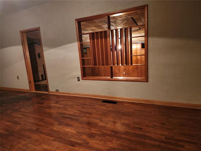 Unfurnished room with dark wood-type flooring | Image 7
