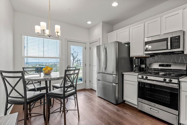 There is plenty of space in the kitchen for additional dining options. | Image 4
