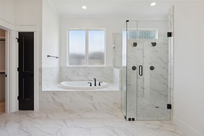 Bathroom featuring ornamental molding, independent shower and bath, and a healthy amount of sunlight | Image 31