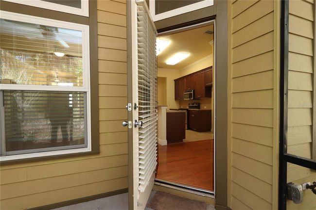 View to kitchen from screened porch | Image 9