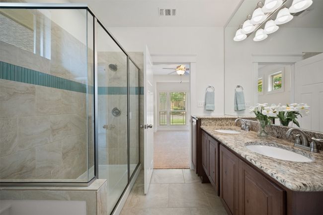 The ensuite bath mirrors that sense of seclusion, spacious enough for you to take your time unwinding | Image 21