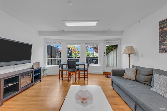 Living area featuring light wood finished floors and baseboards | Image 27
