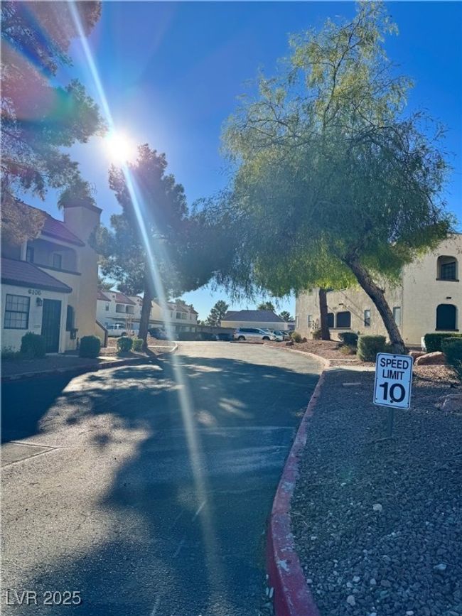 View of asphalt street featuring curbs and a residential view | Image 19