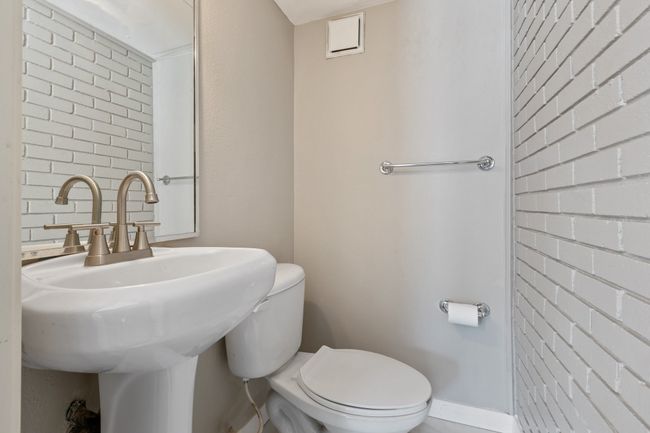 Half bath featuring toilet and a sink | Image 12