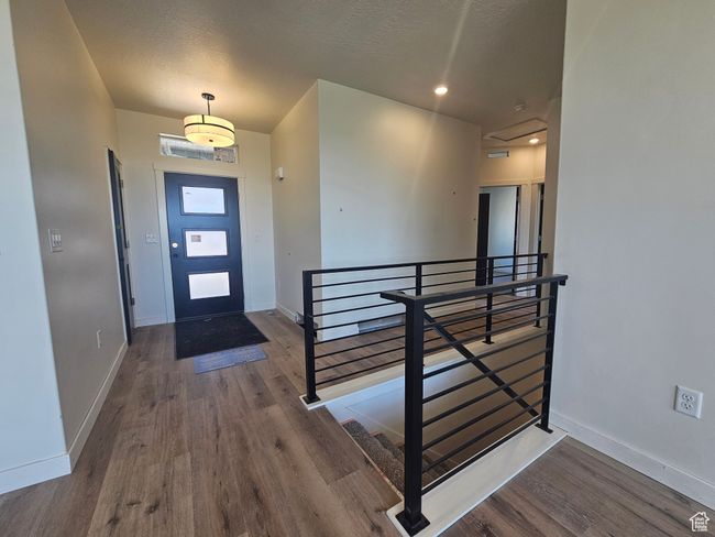 Foyer entrance featuring wood finished floors and baseboards | Image 13