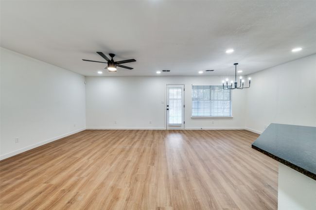 Unfurnished living room featuring recessed lighting, light wood-style flooring, and baseboards | Image 9