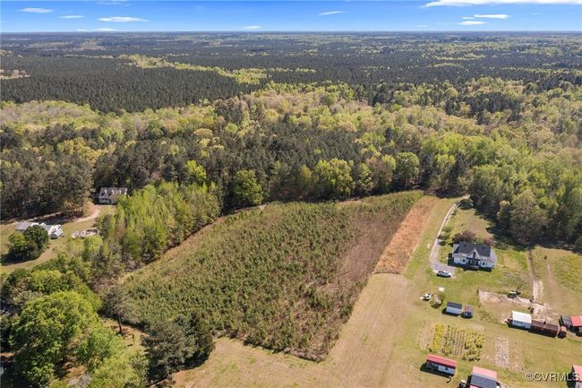 Birds eye view of property featuring a forest view | Image 36