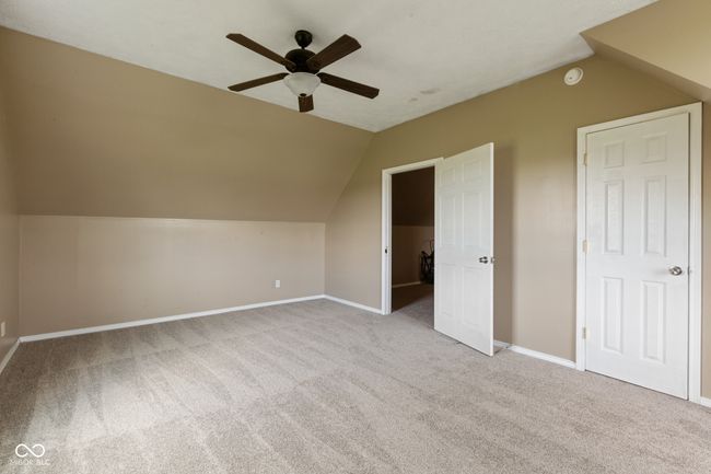 additional living space with ceiling fan, baseboards, carpet, and vaulted ceiling | Image 17