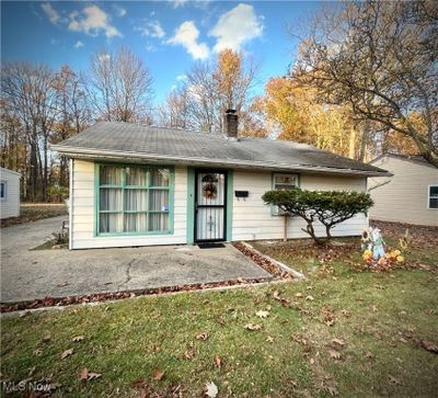 Back of house with a lawn and a patio area | Image 1