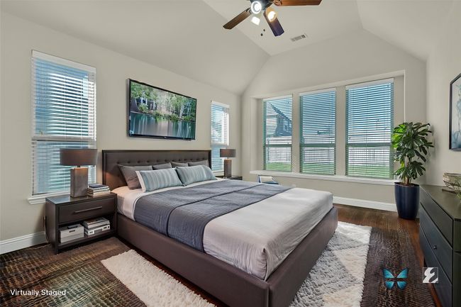 Elegant and expansive master bedroom, offering a serene retreat. | Image 14