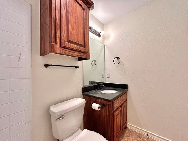 Bathroom featuring vanity and tile patterned flooring | Image 12