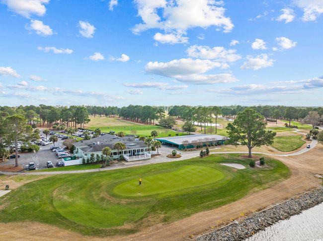 Aerial view of a golf club and a tree filled landscape | Image 28