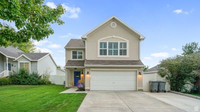 Front of property featuring a garage and a front lawn | Image 1