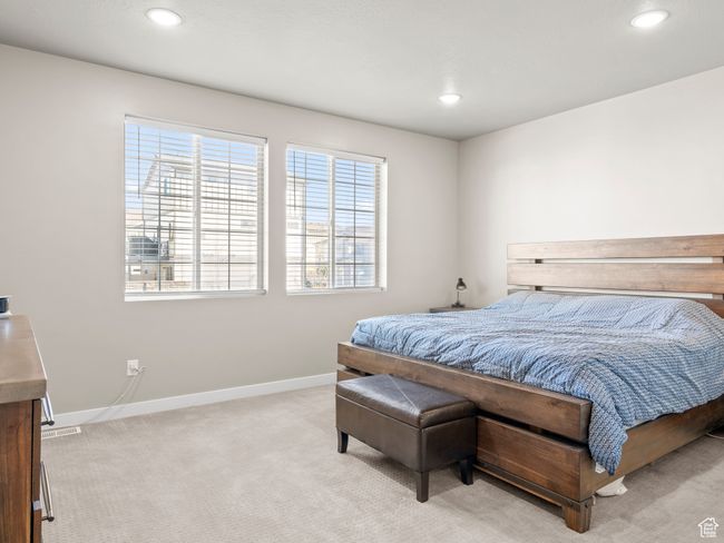 Bedroom with light carpet and recessed lighting | Image 15