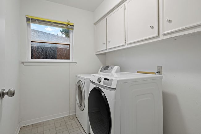 Laundry area with baseboards, cabinet space, and washer and dryer | Image 24