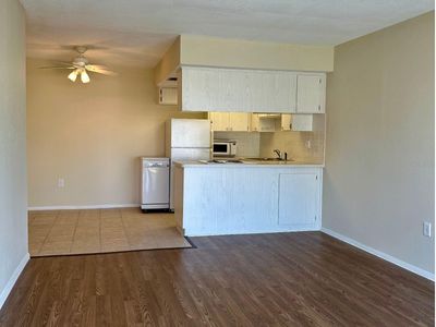 This open floor plan condo exudes cozy vibes with updated paint and floors. Ready for you to call home. | Image 3