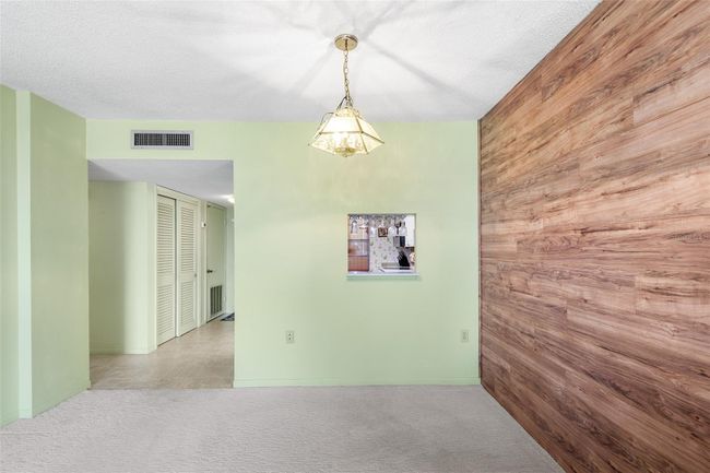 VIEW TOWARDS DINING AREA, FRONT ENTRY AND PASS THRU FROM KITCHEN. NICE STORAGE CLOSET ON LEFT SIDE OF FOYER | Image 8