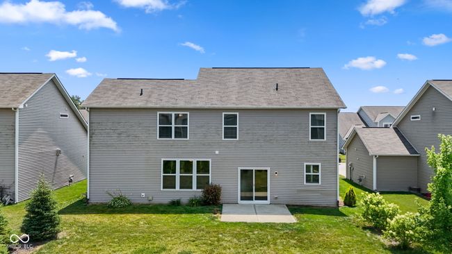 Rear view of property featuring a patio and a professionally landscaped lawn | Image 27