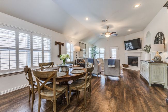 Dining area looking into family room. | Image 11