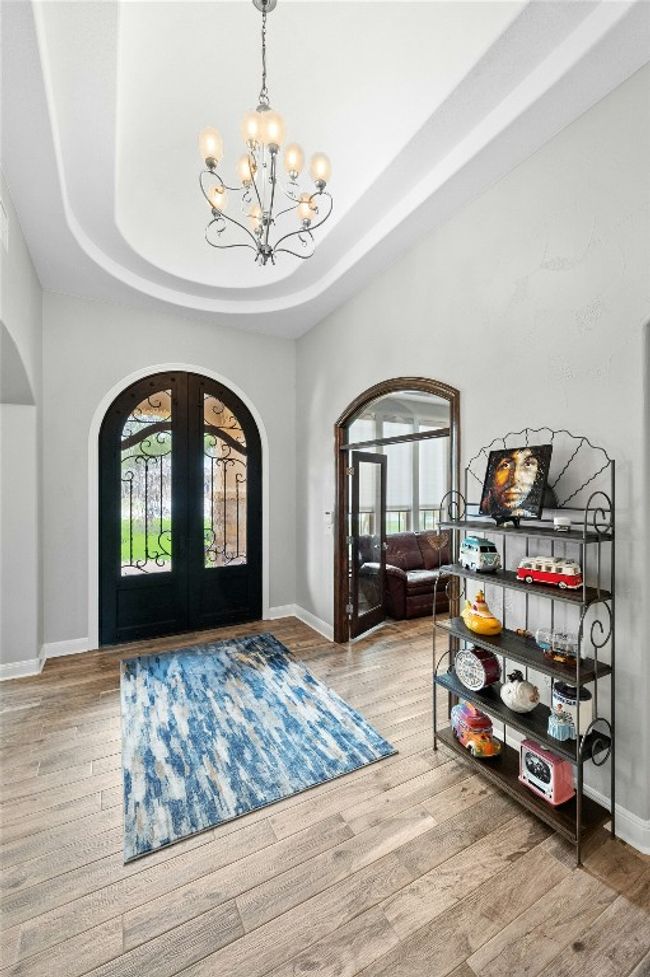 Front foyer is accented by the large tray ceiling. | Image 4