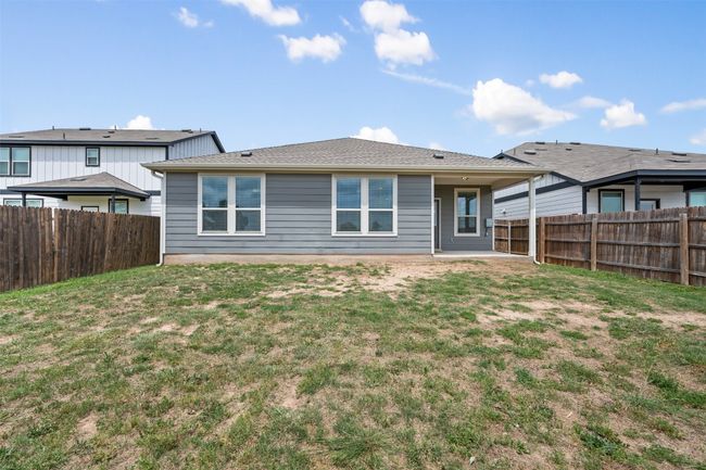 Back of property with a lawn and a fenced backyard | Image 31
