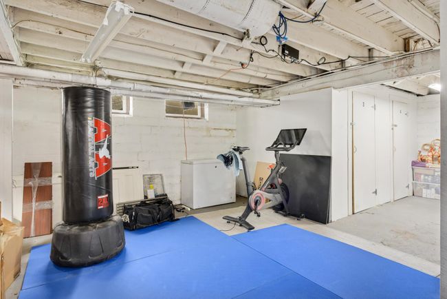 Although privately owned by homeowner neighbors, all are welcome to use the Peloton, boxing bag, and workout space. To the right you will see #3's private storage room. | Image 22