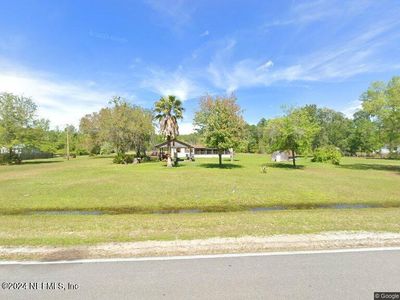 Street view from County Road 208. Over 300 feet of frontage! | Image 3