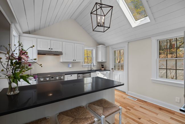 Cathedral ceiling and skylight - bright and airy space! | Image 7
