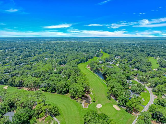 Aerial view of property's location with a local golf course and a nearby body of water | Image 34