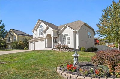 View of front property with a front lawn and a garage | Image 2