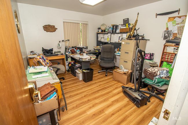 Home office with wood finished floors | Image 22