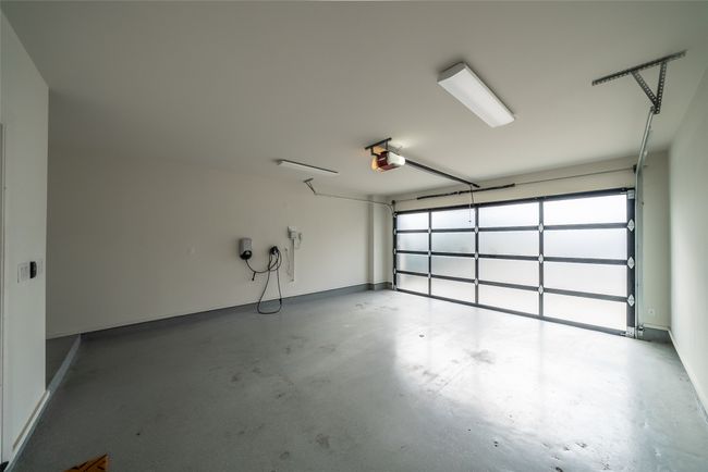 Garage featuring a garage door opener | Image 39