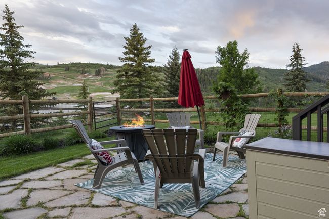 View of patio featuring a fire pit | Image 41