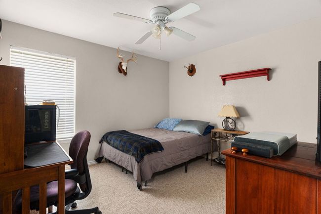 Secondary bedroom large enough for an office area | Image 15