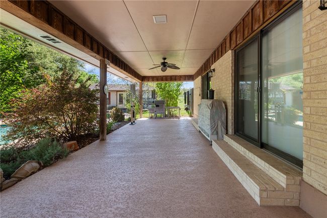 View of patio / terrace with outdoor dining space and a ceiling fan | Image 31