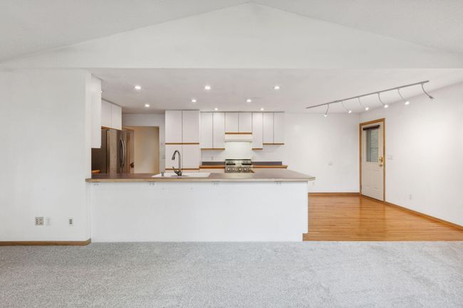 Kitchen open to family room. | Image 18