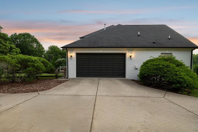 Aerial view of the property situated on a private, park-like one-acre lot. | Image 40