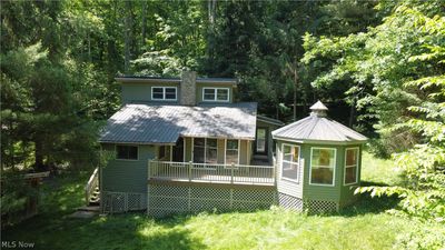 Back of house with a wooden deck | Image 3