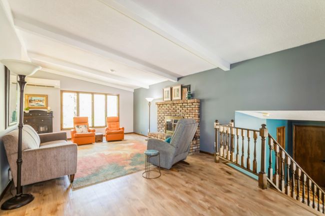 Main level living room is spacious and a wonderful space to gather with friends and family! | Image 10