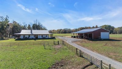 Sprawling 40-acre farm with 8 acres fenced for cattle, featuring a charming farmhouse and a spacious shop. Perfect blend of rural living and practicality, offering ample space for farming, livestock, and storage in a peaceful countryside setting. | Image 2