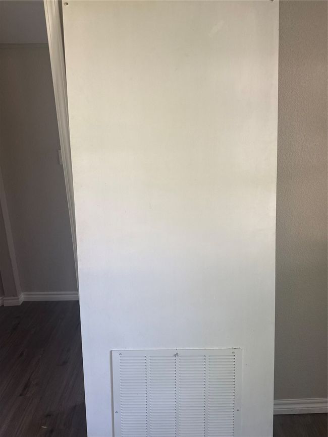 Detailed view of wood finished floors and baseboards | Image 13