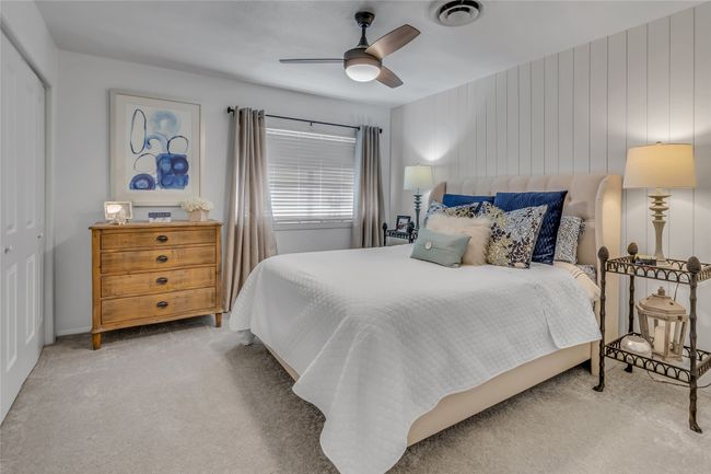 Bedroom with carpet flooring, a closet, and ceiling fan | Image 16