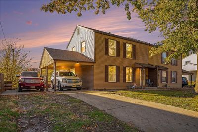 Front of house. Yes the carport is BIG | Image 1