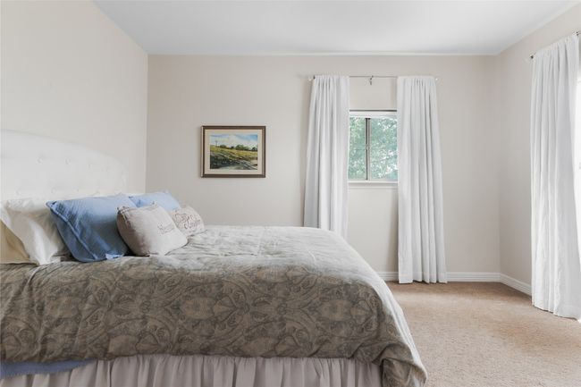 Bedroom featuring carpet floors and baseboards | Image 31