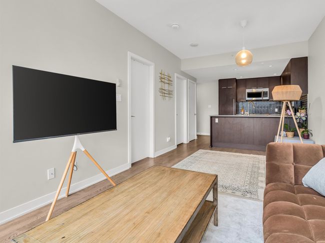 Living room featuring baseboards | Image 8